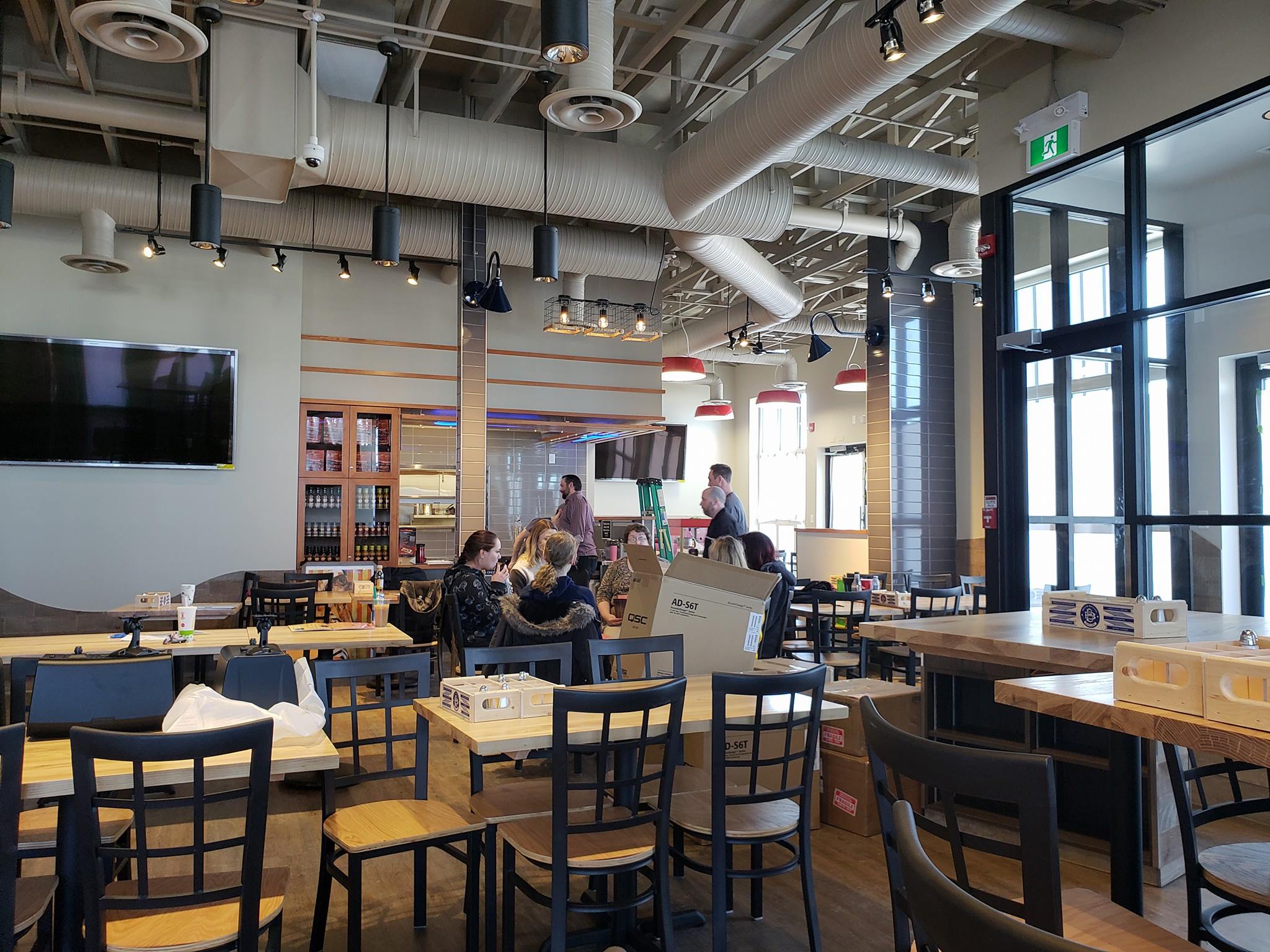 Restaurant dining room with TVs