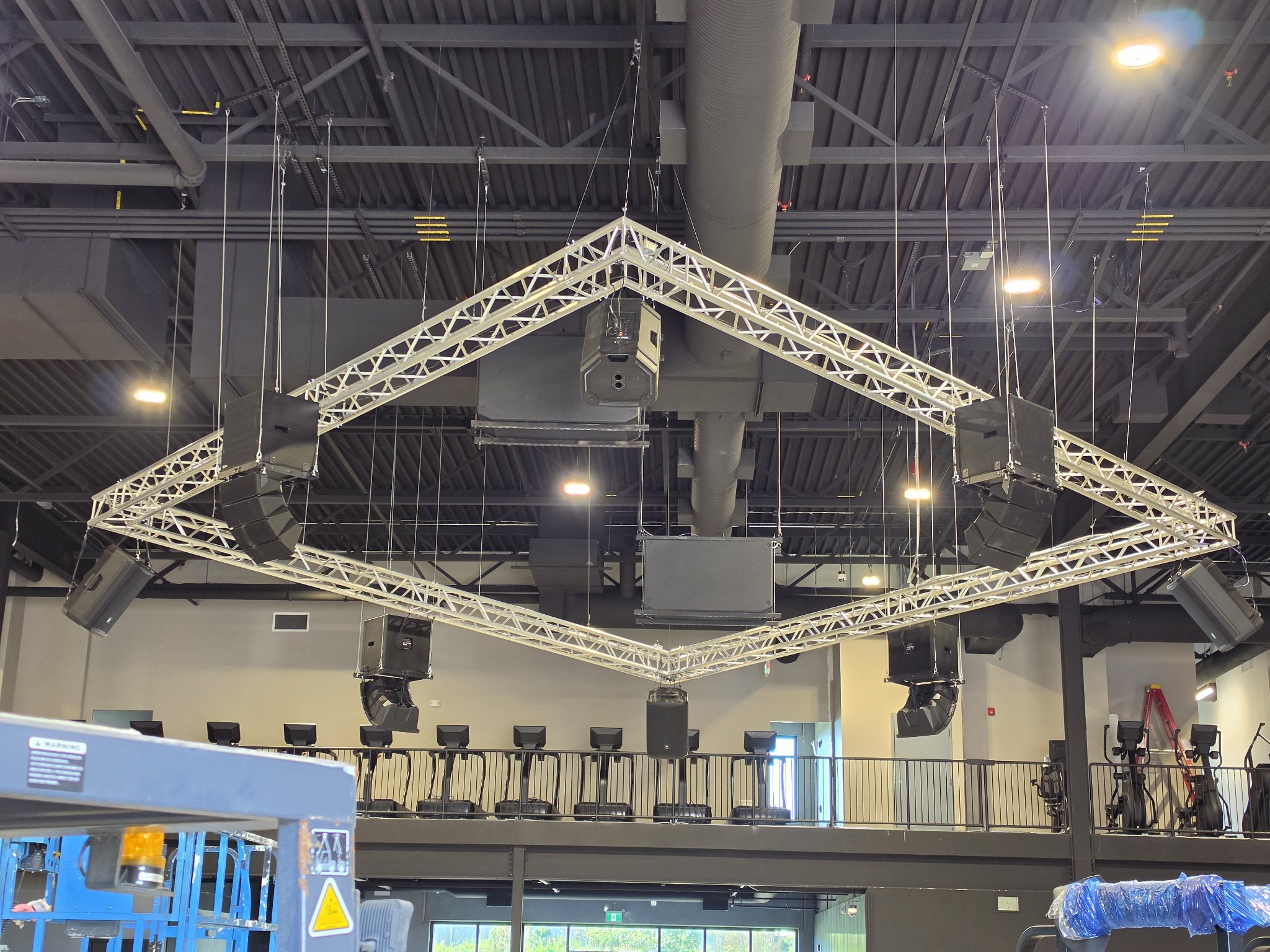 Diamond truss rig with flown speakers at Iron Lore Gym
