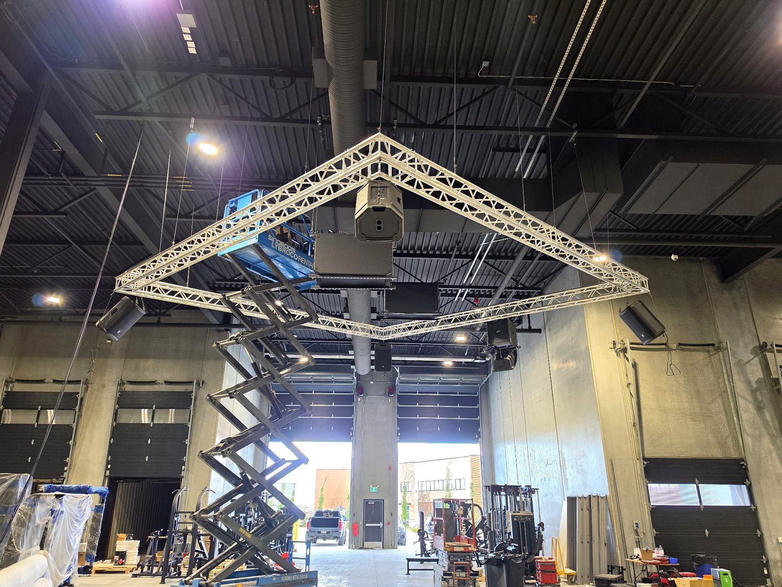 Speaker cluster mounted on truss